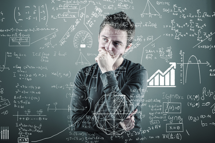 Teenager and blackboard with math equations