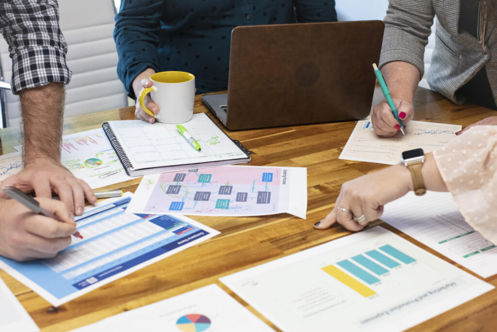 A group of marketers huddled around a conference table
